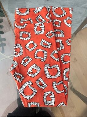 LuLaRoe Orange Leggings with White Teeth Print